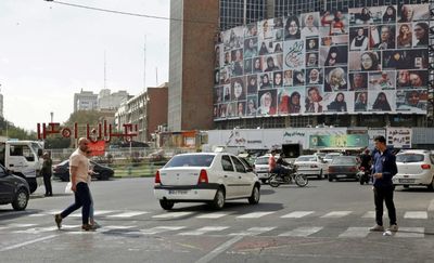 Tehran billboard of famous women in hijab changed a day after going up