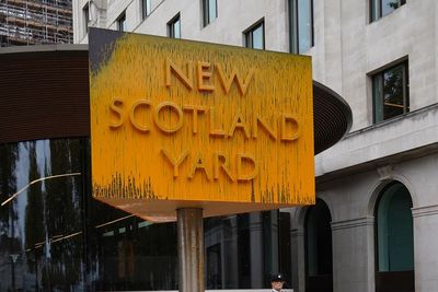 24 protesters arrested after New Scotland Yard sign covered with yellow paint