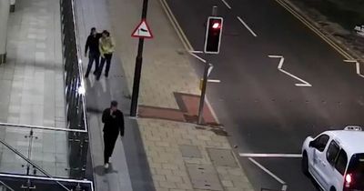 Disgust as Leeds CCTV shows two men 'celebrating' after gang's 'unprovoked racist attack' on man walking to gym