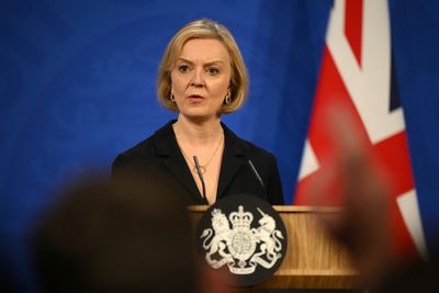 Fighting for survival as UK PM, a chastened Truss changes course again