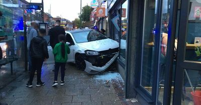 Car crashes into front of shop on main Nottingham road
