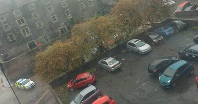 Edinburgh woman rushed to hospital as emergency services cordon off quiet street
