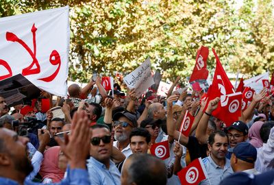 Thousands from rival Tunisian parties protest against president