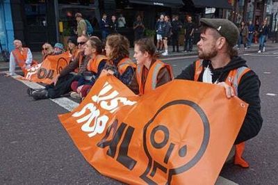 Just Stop Oil activists bring traffic to a halt in Shoreditch