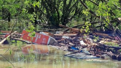 Tasmanians urged to be vigilant as the flood threat eases but premier warns 'not over yet'