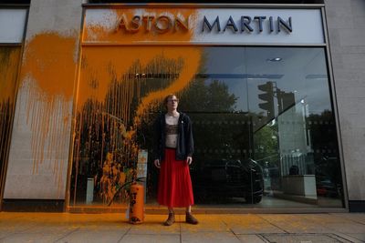 Just Stop Oil supporters spray paint over Aston Martin showroom in London