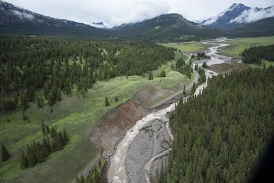 Yellowstone National Park has reopened an entrance devastated by June floods