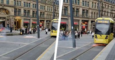 Video captures screams as lit fireworks launched towards tram in Manchester city centre