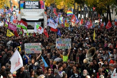 Protesters march in Paris as French refinery strikes continue