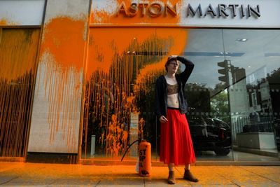 Aston Martin showroom hit as UK vows action on climate protests