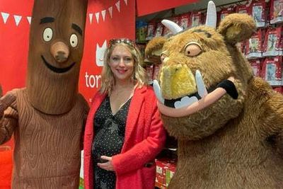 Pregnant former Hollyoaks star Ali Bastian shows off growing baby bump during fun family day out in London