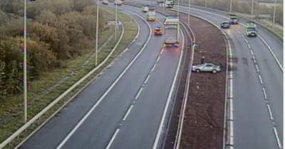 Car crashes into verge on M90 sparking delays as police rush to scene