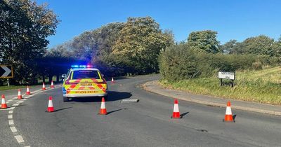 Woman dies in car crash as road closed for hours