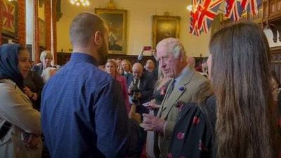 King meets refugees who have settled for new life in Scotland