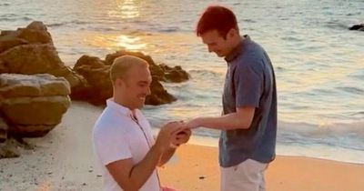 Adorable moment couple propose to each other at exactly the same time on dream holiday