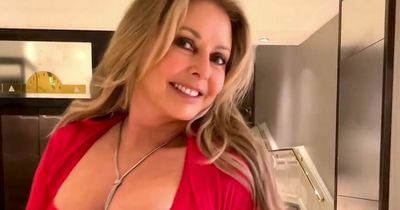 Carol Vorderman shows off curves in clinging red dress after spilling fitness secrets