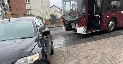 Front of Edinburgh bus torn off in crash with car on busy main road