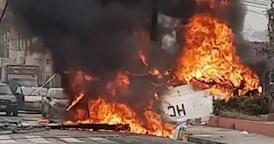 Plane crashes into city in fiery wreck killing two after 'zigzagging' in the air