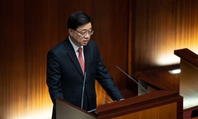 Hong Kong leader aims to attract talent but vows further crackdown