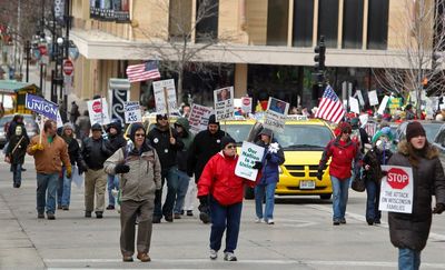 Illinois takes center stage in battle over union rights vote