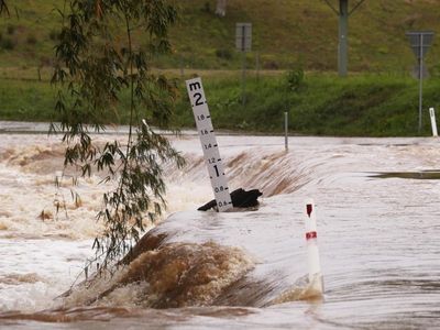 Qld woman rescued, dangerous storm warning