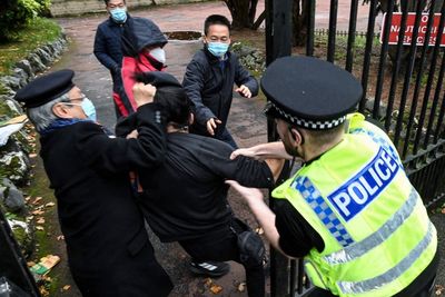 Chinese diplomat defends grabbing Hong Kong protester’s hair in Manchester