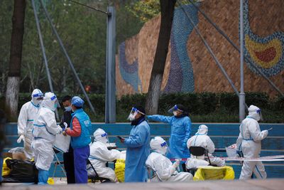 Chinese capital steps up COVID measures as cases quadruple