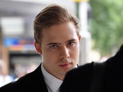 Swim coach Daniels cleared of some charges