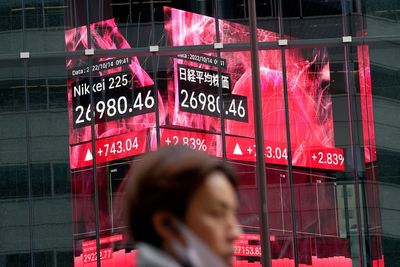 Asian shares fall after weak earnings pull Wall St lower