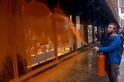 Just Stop Oil protesters spray Harrods with orange paint