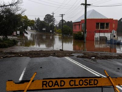 'Battered' NSW braces for continued floods
