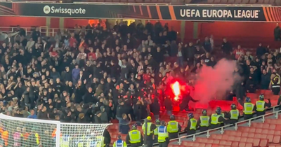 PSV supporters spotted throwing flares into Arsenal supporters after Europa League defeat