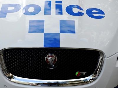 Charges after man pinned in Sydney crash