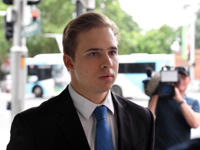 Swim coach cleared of further charges