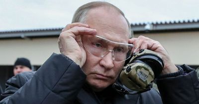 Bizarre claim Vladimir Putin’s body double actually fired sniper rifle at training base