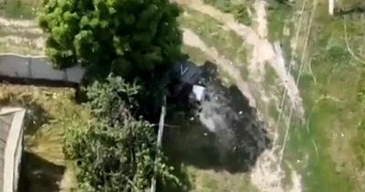 Thieving Russian soldiers caught leaving house in invaded Ukraine with washing machine