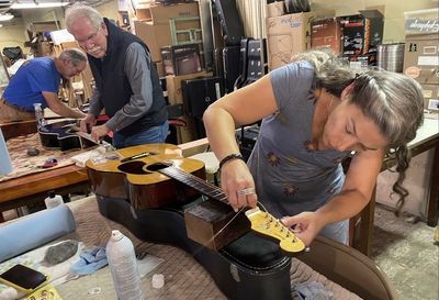 Volunteers refurbish musical instruments to donate to Eastern KY flood victims