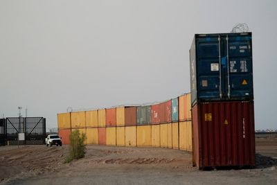 Arizona sues US over containers along border with Mexico