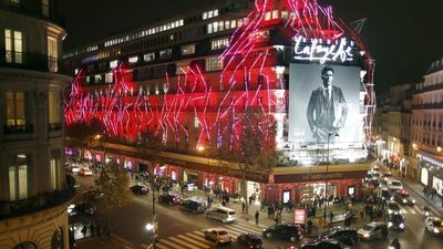 French climate activists target store lights in Paris night raids