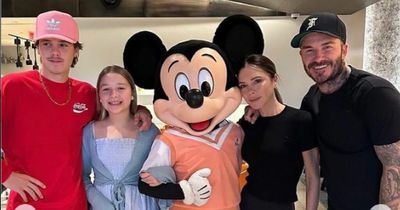 Victoria Beckham 'looks 21' as she admits to 'missing' her two sons on family trip to Disney - and adorably twins with daughter Harper