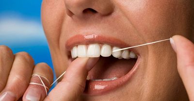 Tell-tale signs you're not flossing enough - from bad breath to puffy gums
