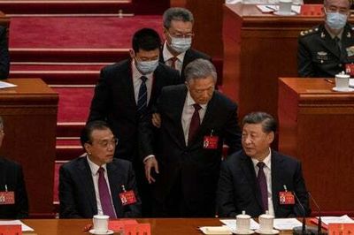 Former Chinese president Hu Jintao unexpectedly led out of party congress