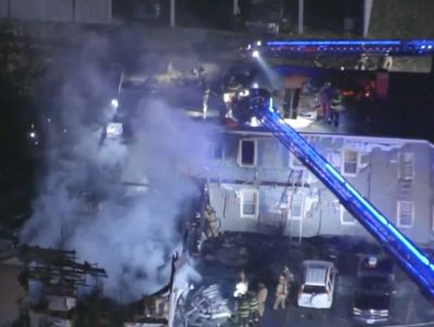 Plane crashes into New Hampshire apartment building, killing everyone onboard