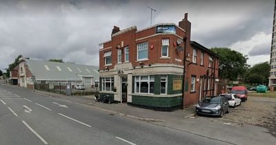 Leeds pub taped off by police as 'injured' woman rushed to hospital