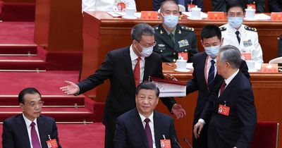 Ex-China president escorted out of party meeting - before 'vanishing' from internet