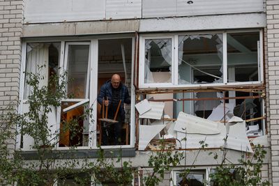 Russia hits Ukraine homes, evacuates Kherson, warns of escalation