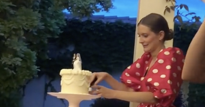People divided as guest mistakenly cuts into bride and grooms wedding cake before their big moment