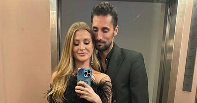Millie Mackintosh wears little black dress and cosies up to husband Hugo on rare night out