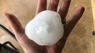Large parts of central and north Queensland hit by hail as storms, heatwave lash state