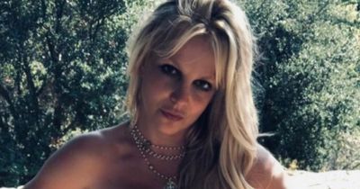 Britney Spears goes topless and posts cryptic message as she returns to Instagram